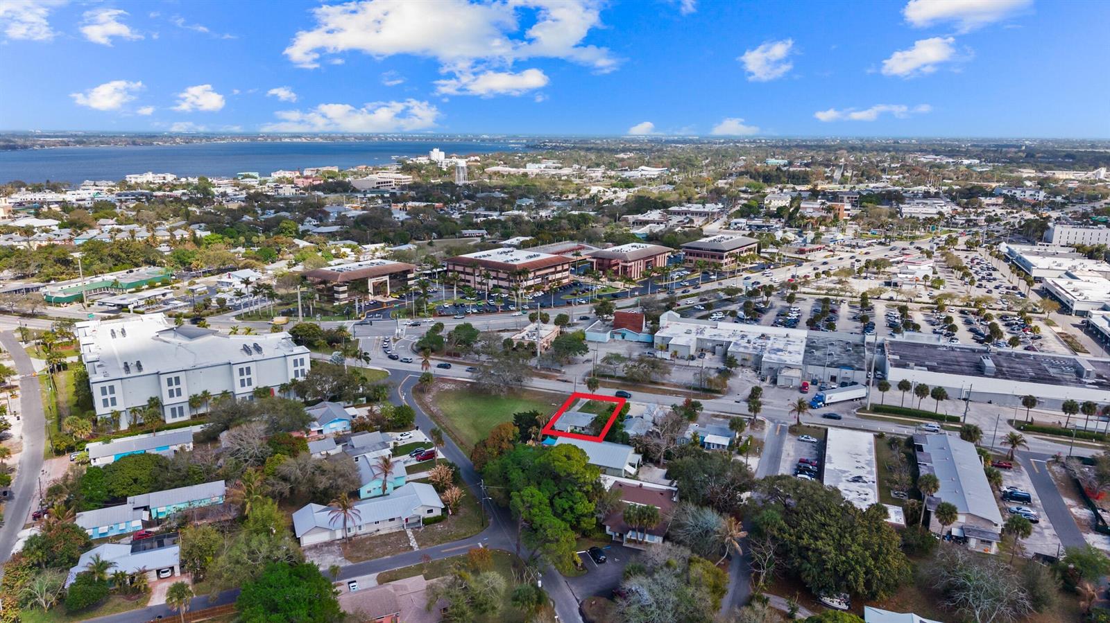 An aerial view shows a residential property outlined in red within a suburban neighborhood — 820 SW Palm City Road, Stuart FL 34994, STUART, FL
