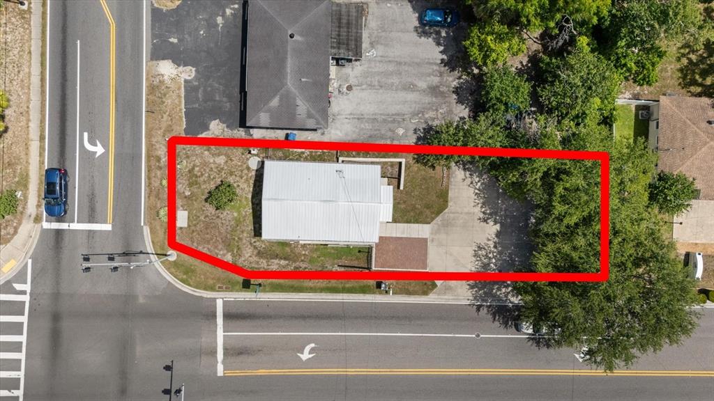 An aerial view shows a rectangular lot with a house and driveway outlined in red — 6511 MAIN STREET, NEW PORT RICHEY, FL