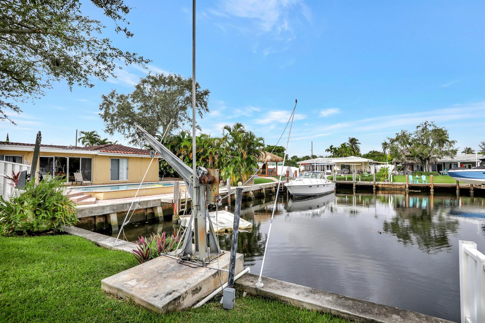 An aerial view shows a house with a gray roof, a pool, and a backyard — 421 SE 5 Terrace, Pompano Beach FL 33060, POMPANO BEACH, FL