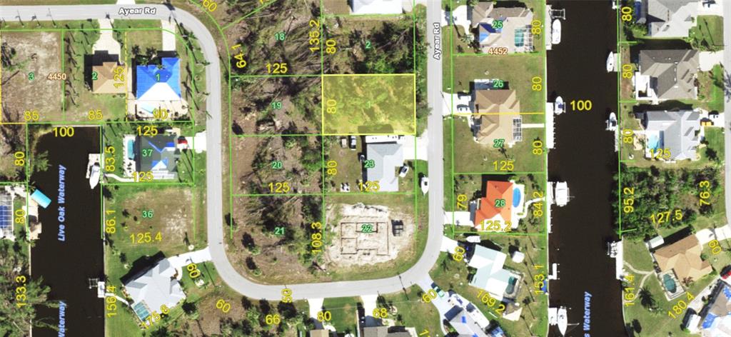 This is an aerial map showing residential lots, houses, and waterways in a neighborhood — 10593 AYEAR ROAD, PORT CHARLOTTE, FL