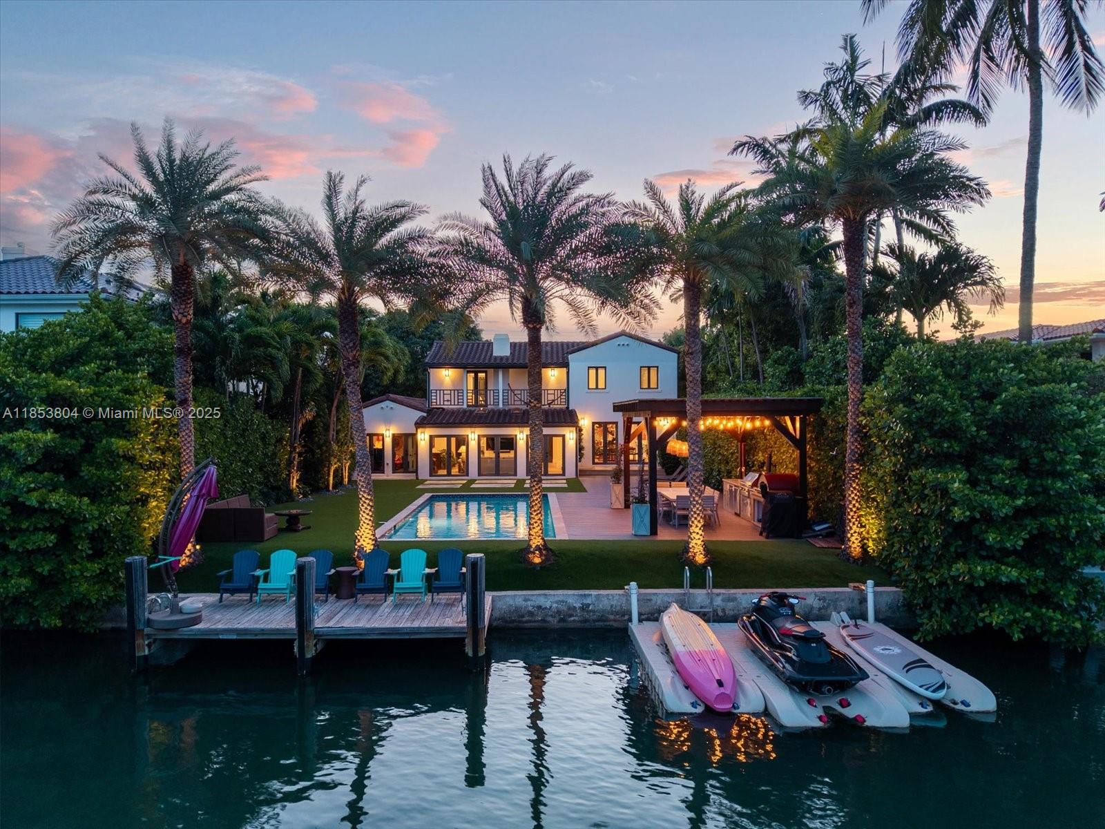 An aerial view of a waterfront house with a pool, patio, and private boat dock — 4475 N Meridian Ave, Miami Beach FL 33140, MIAMI BEACH, FL