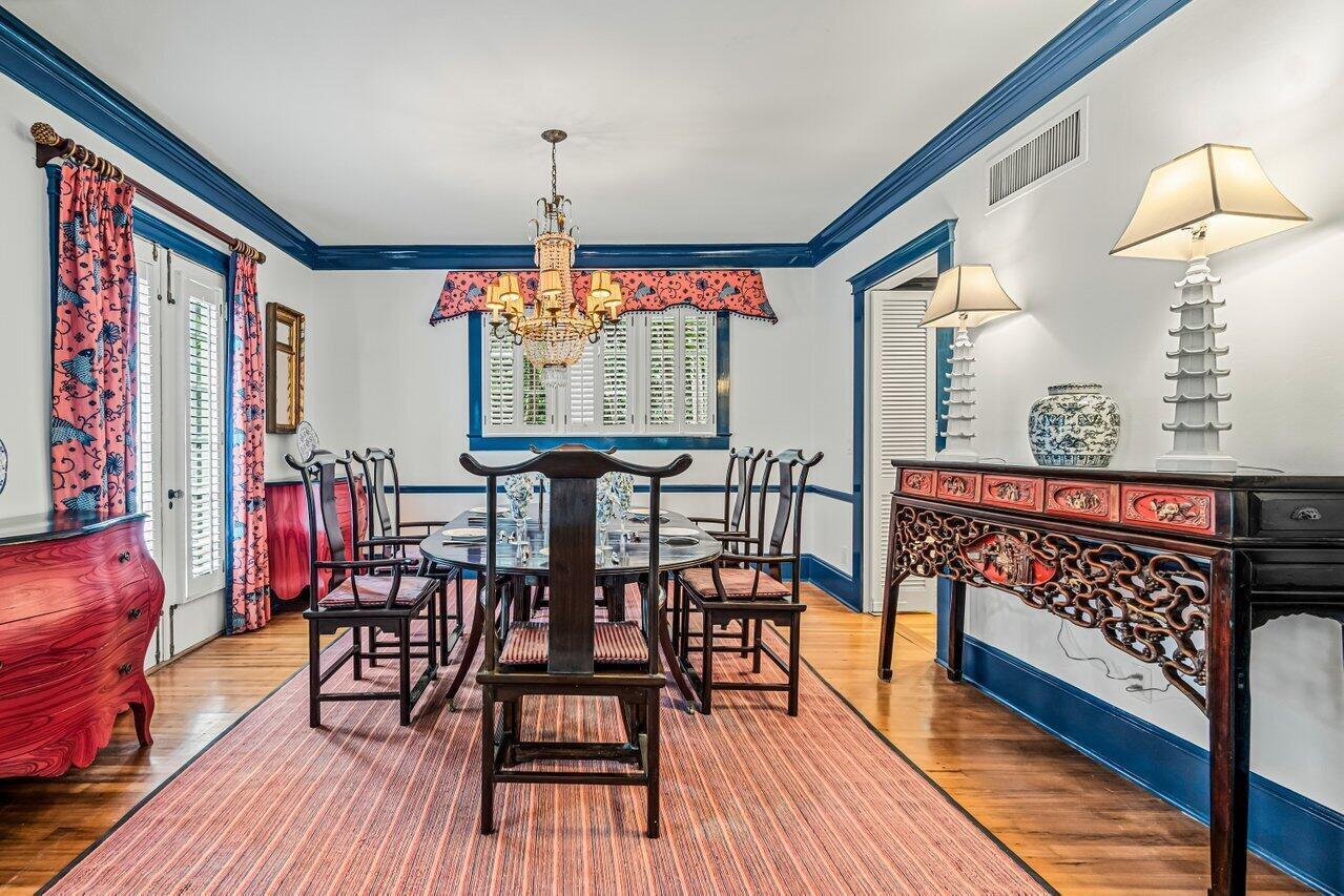 A formal dining room features a dark wood table, Asian-inspired chairs, and blue crown molding — 263 Park Avenue, Palm Beach FL 33480, PALM BEACH, FL