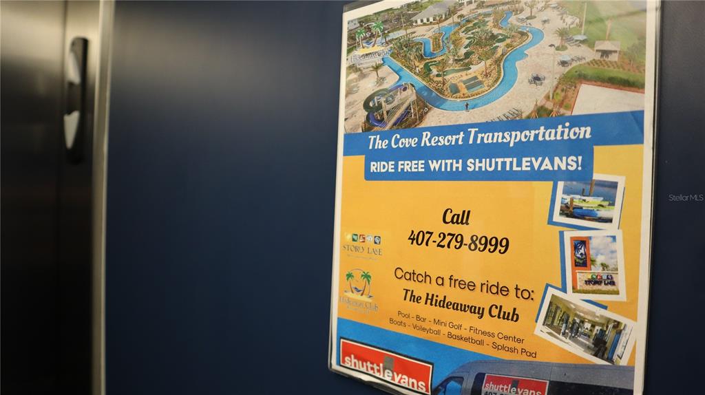 A sign on a blue wall advertises free shuttle transportation to The Hideaway Club — 3120 PARADOX CIRCLE UNIT 205, KISSIMMEE, FL