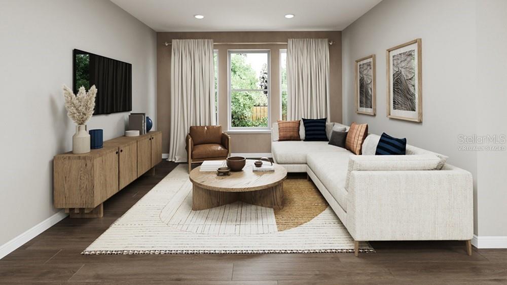 This is a virtually staged rendering of a living room with a sectional and media console — 12813 DOCKYARD TRAIL, PALMETTO, FL