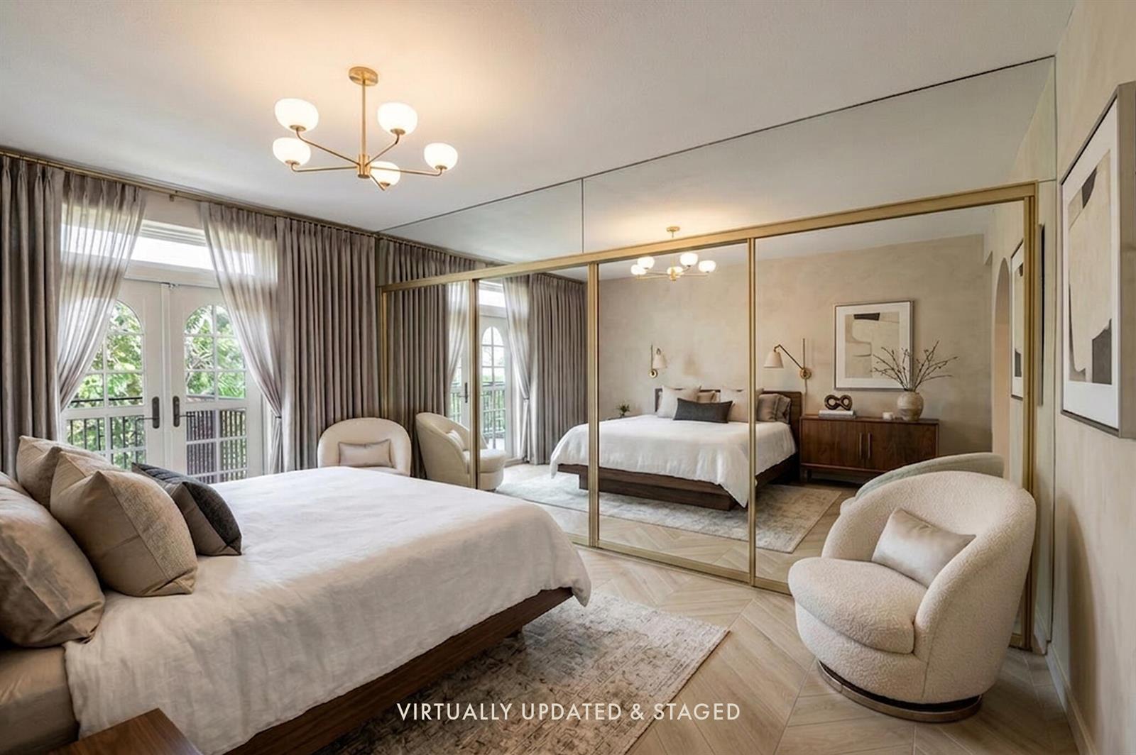 A bedroom with a large mirrored closet, a bed, a swivel chair, and French doors — 3475 S Ocean Boulevard # 116, Palm Beach FL 33480, PALM BEACH, FL