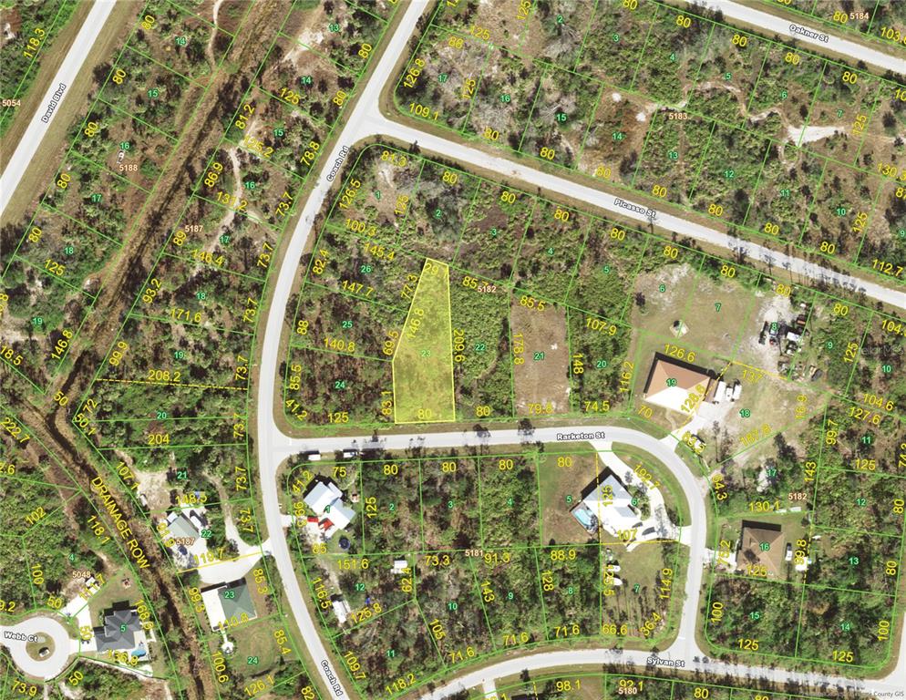 This is an aerial map showing a vacant lot highlighted in yellow within a residential neighborhood — 12340 RARKETON STREET, PORT CHARLOTTE, FL