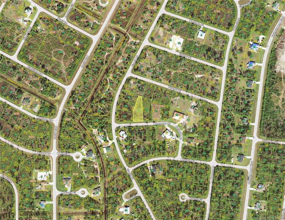 This is an aerial map showing a highlighted vacant lot in a residential neighborhood — 12340 RARKETON STREET, PORT CHARLOTTE, FL