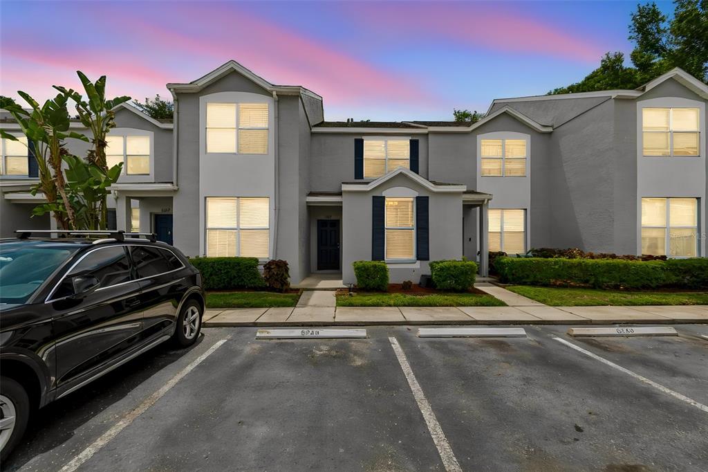 A two-story gray townhouse exterior with a black car parked in front — 6245 OSPREY LAKE CIRCLE, RIVERVIEW, FL
