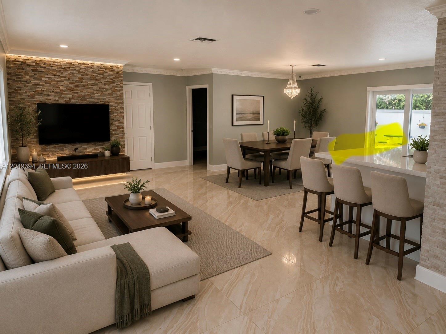 An open-concept living and dining area features stone accent walls, tile flooring, and neutral furniture — 9675 SW 19th St, Miami FL 33165, MIAMI, FL