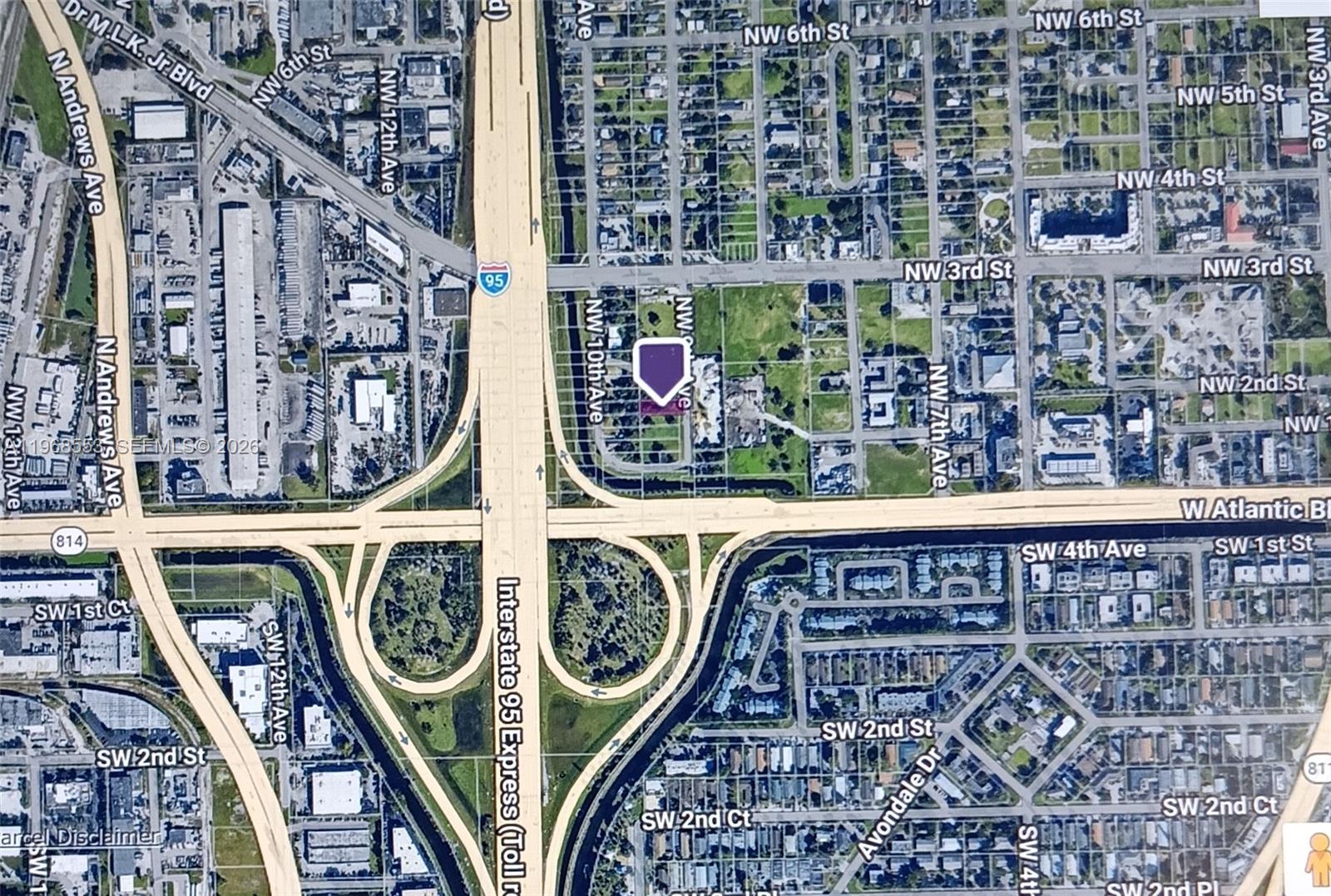 This is a satellite map showing a property location marked with a purple pin — 0 NW 9th Ave, Pompano Beach FL 33060, POMPANO BEACH, FL