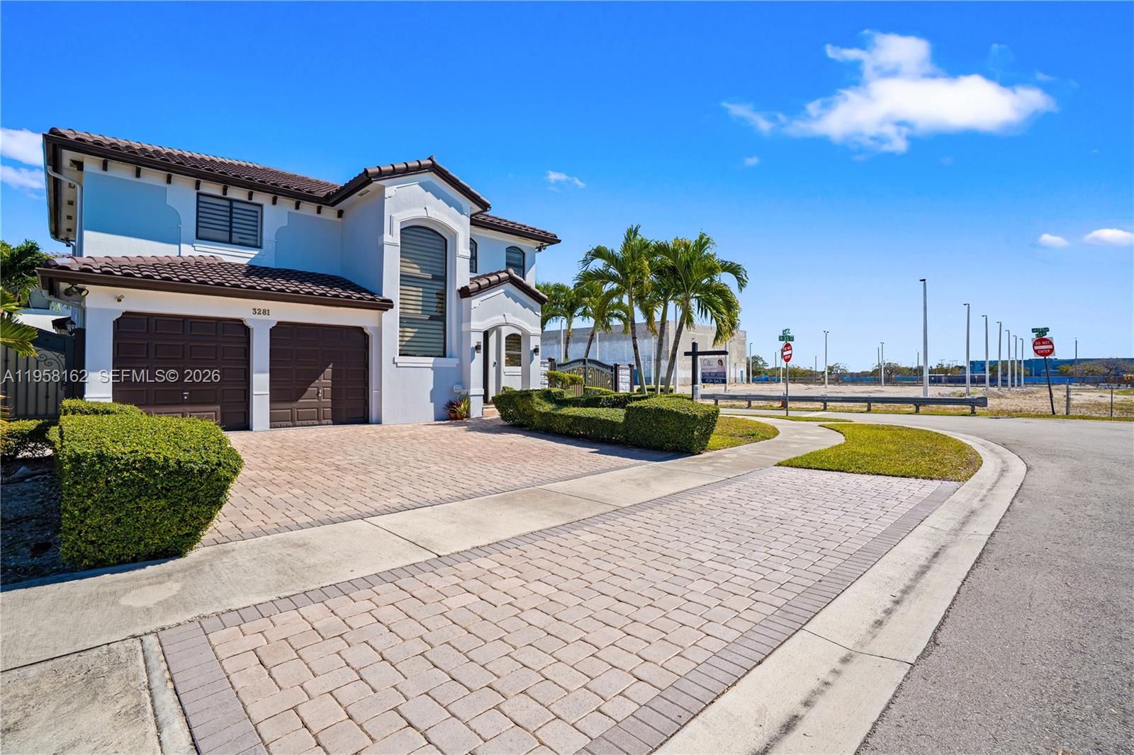 A two-story house with a two-car garage and a paved driveway sits on a corner lot — 3281 SW 145th Ave, Miami FL 33175, MIAMI, FL