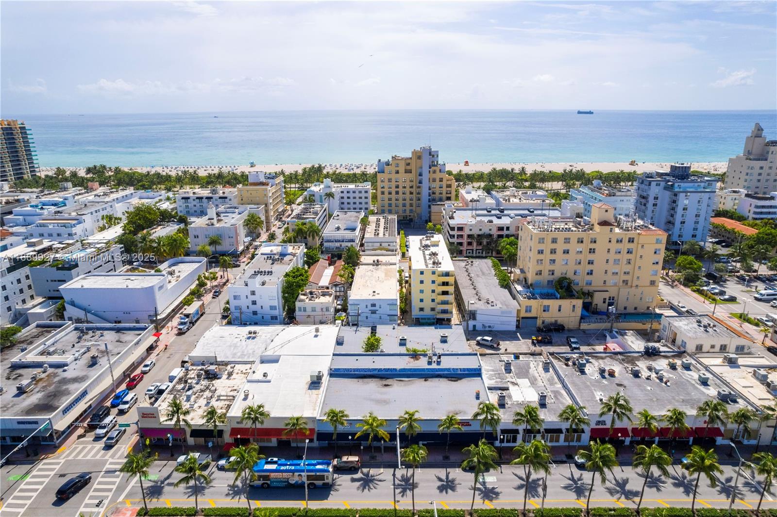 An aerial view shows a city street lined with palm trees near a sandy beach — 1345 Washington Ave, Miami Beach FL 33139, MIAMI BEACH, FL