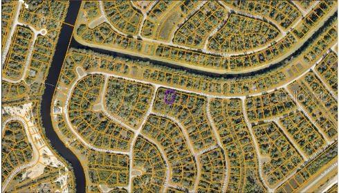 This is an aerial map view of a residential neighborhood with highlighted property boundaries — NEWMAN DRIVE, NORTH PORT, FL