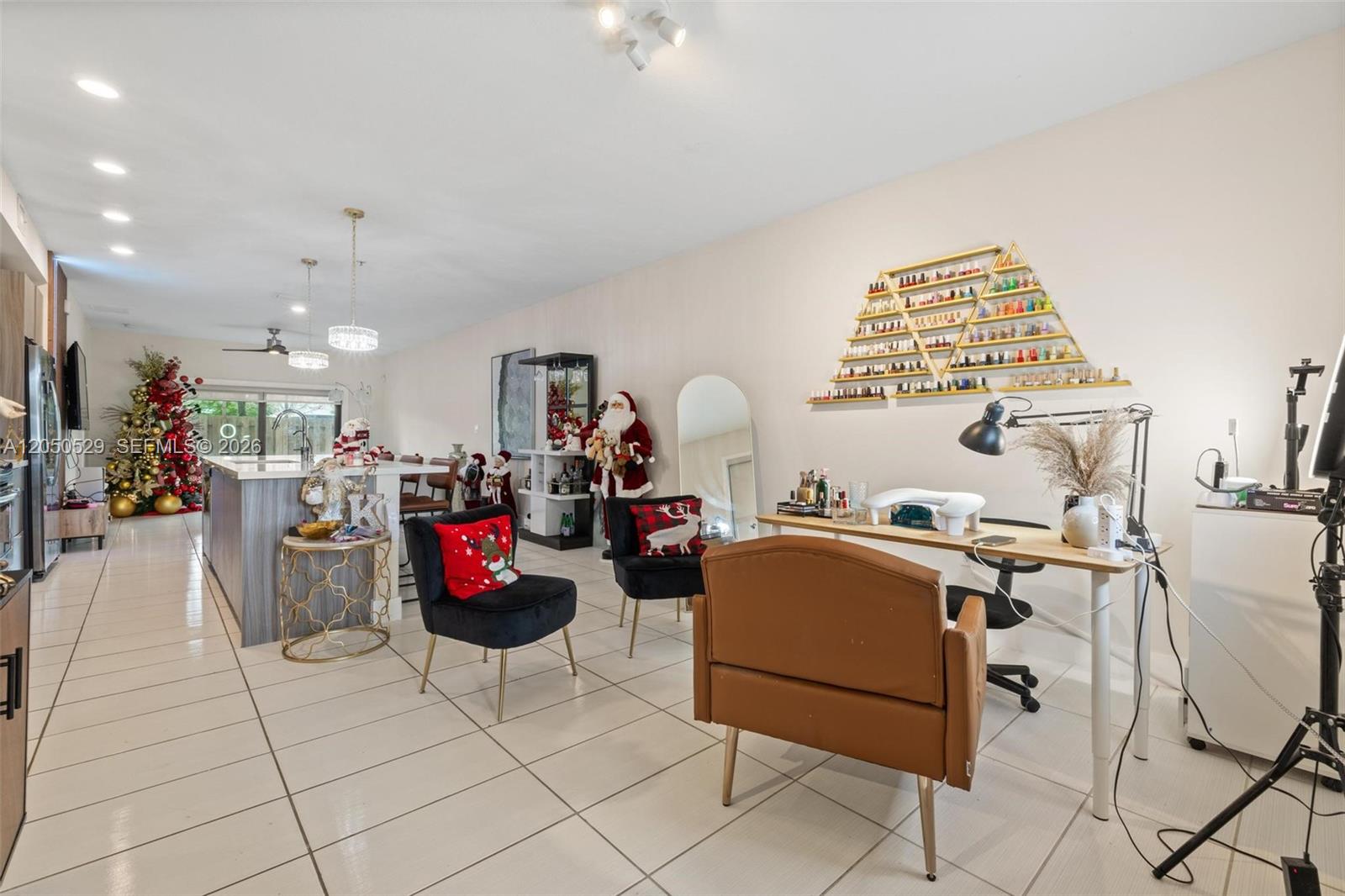 A bright, open-concept room features a kitchen area and a dedicated nail salon workspace — 7809 NW 104th Ave # 1, Doral FL 33178, DORAL, FL