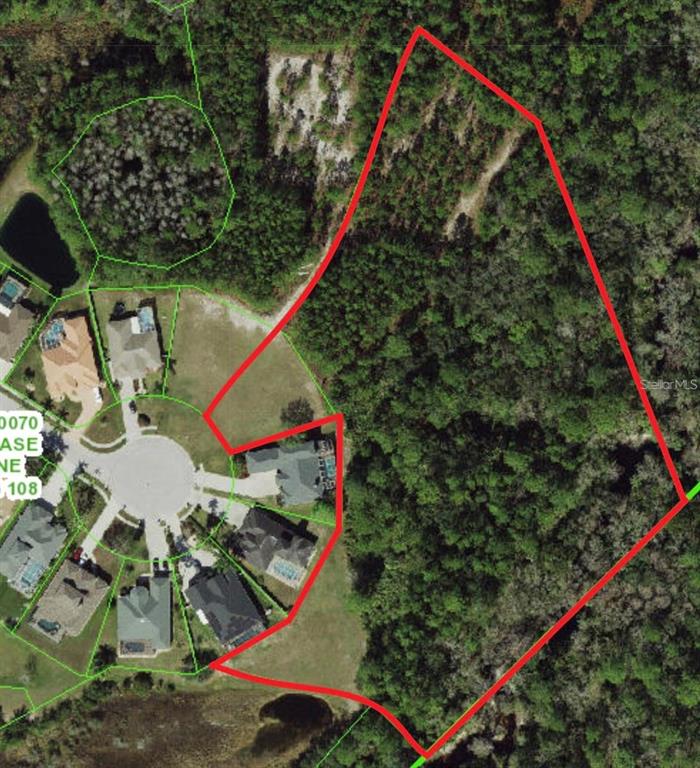 An aerial map shows a large, wooded residential lot outlined in red next to a cul-de-sac — 0 SHOOTING STAR COURT, NEW PORT RICHEY, FL
