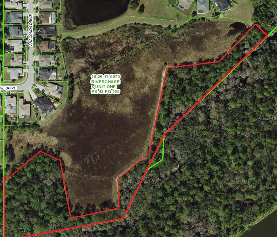 An aerial map shows a large, irregularly shaped plot of land outlined in red — 0 SHOOTING STAR COURT, NEW PORT RICHEY, FL