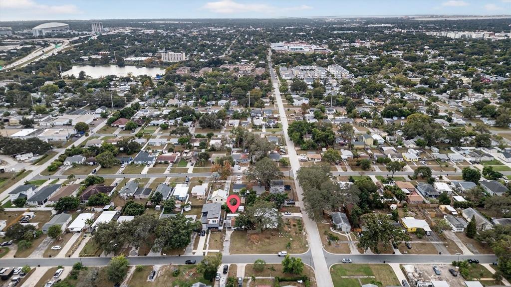 An aerial view shows a residential neighborhood with a red pin marking a specific house — 2480 18TH AVENUE N, ST PETERSBURG, FL