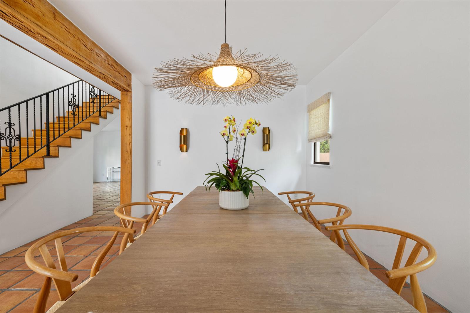 A dining room features a long wooden table, wishbone chairs, and a large woven pendant — 269 Park Avenue, Palm Beach FL 33480, PALM BEACH, FL