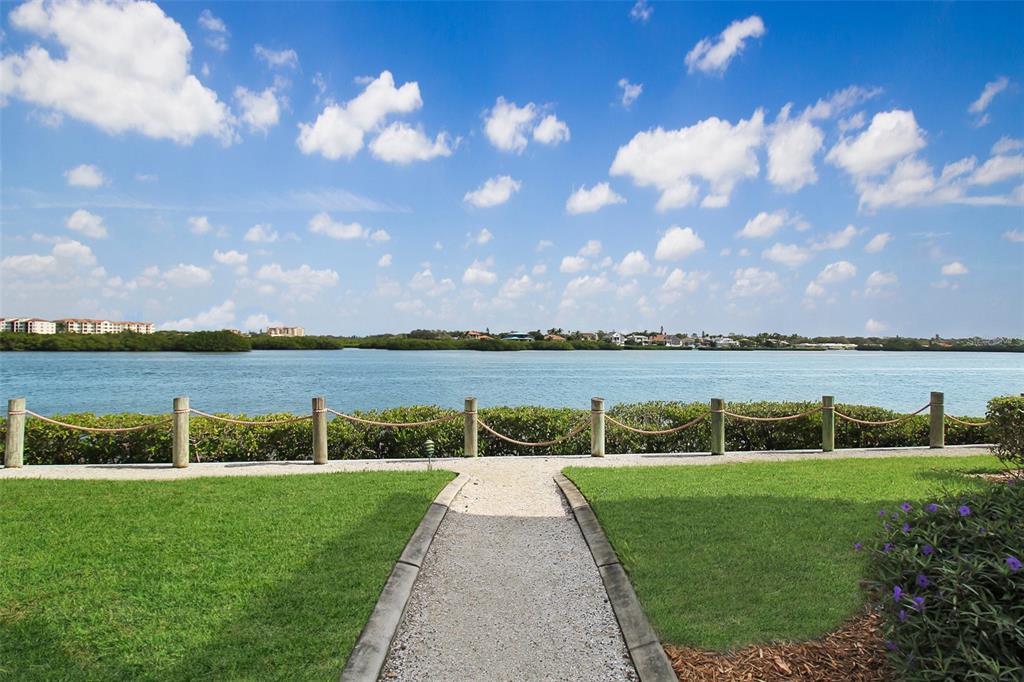 A gravel path leads to a rope fence overlooking a body of water and mangroves — 1389 SIESTA BAYSIDE DRIVE UNIT 1389-F, SARASOTA, FL