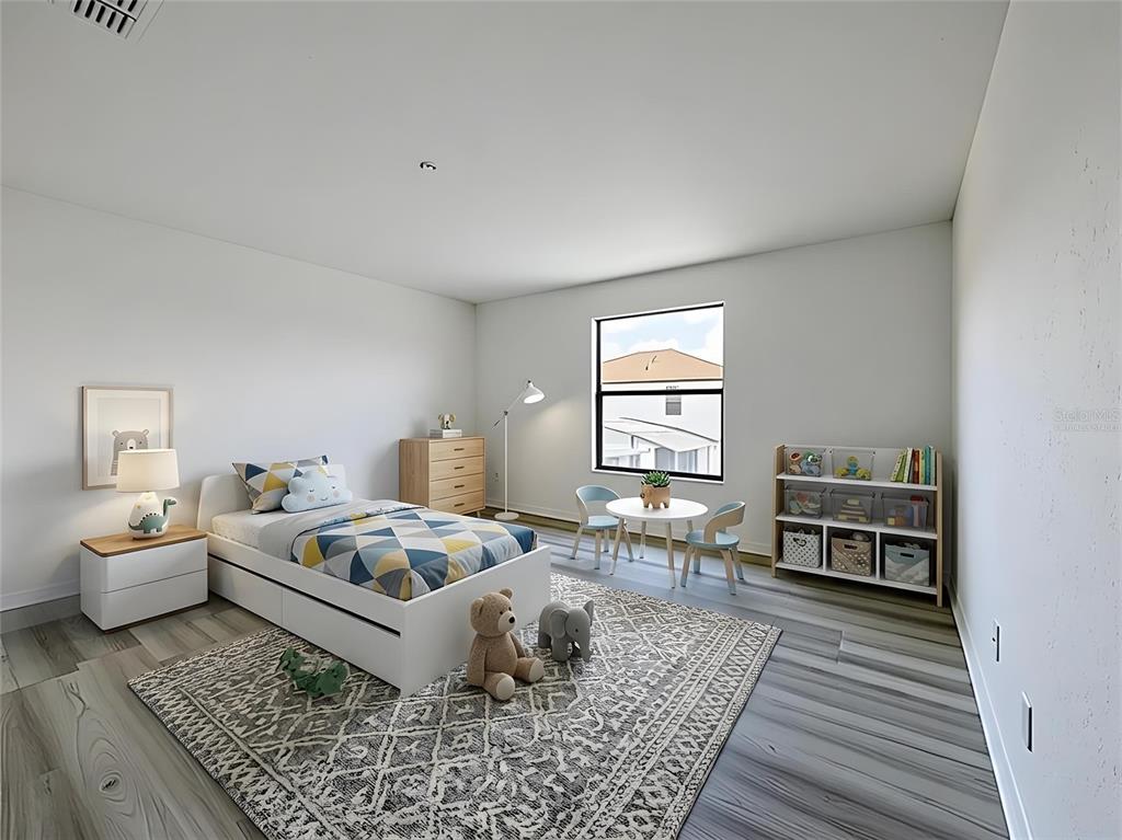 A child's bedroom features a bed, a small table with chairs, and a bookshelf — 16710 CARIBBEAN BREEZE WAY, CLERMONT, FL