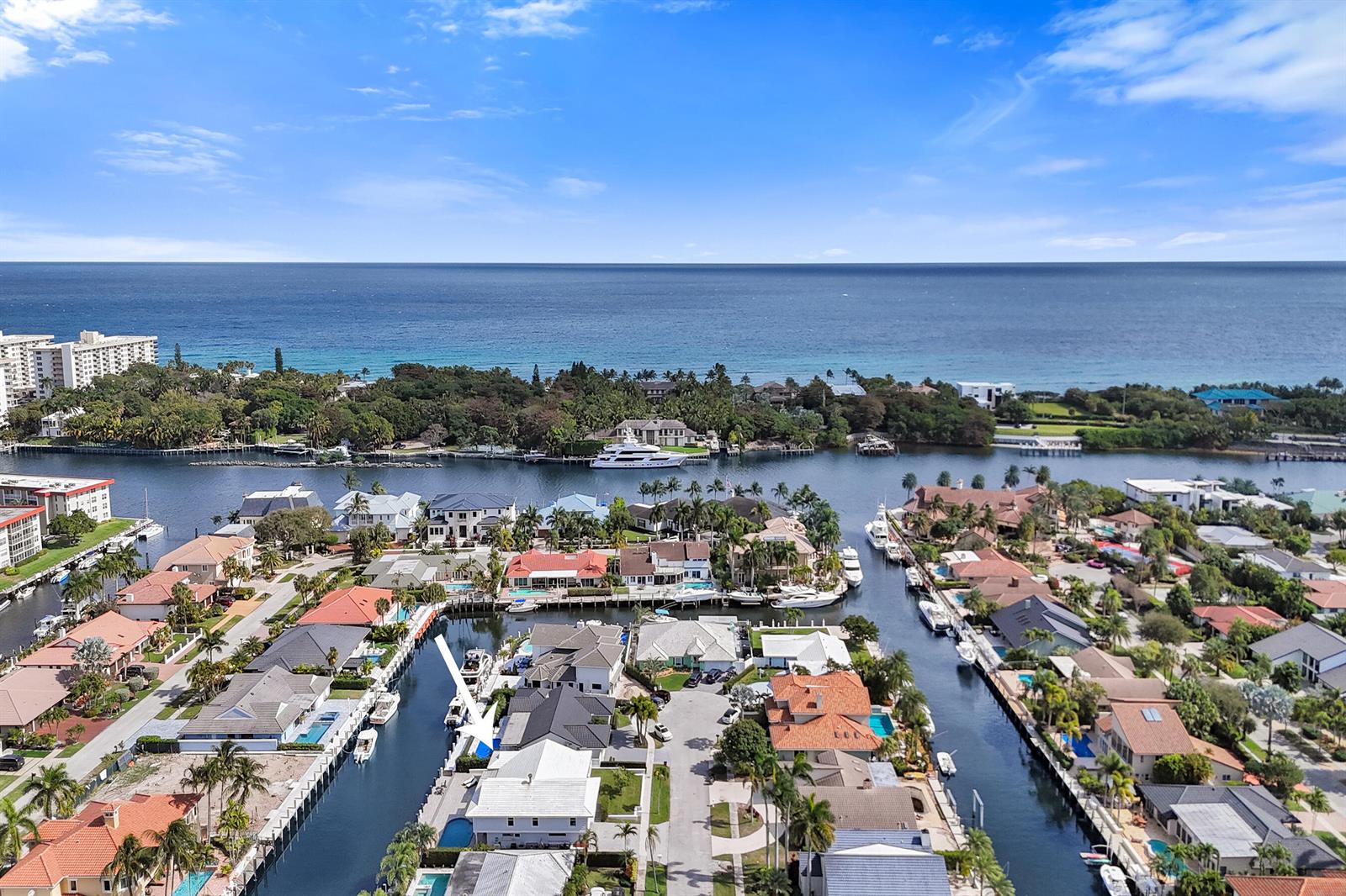 An aerial view shows a waterfront residential neighborhood with canals, boat docks, and houses — 3001 NE 47th Street, Lighthouse Point FL 33064, LIGHTHOUSE POINT, FL