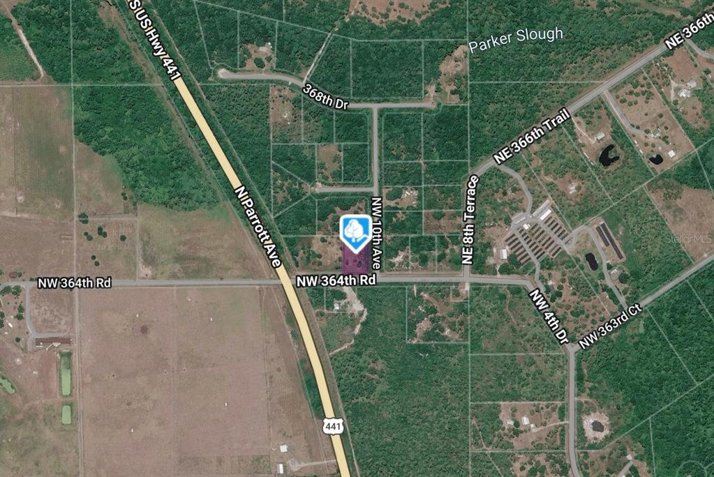 This is an aerial map showing a plot of land near a highway intersection — 1045 NW 364TH ROAD, OKEECHOBEE, FL