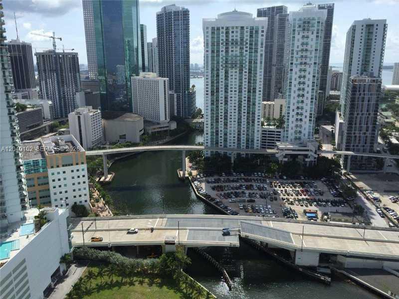 An elevated view of a city skyline, a river, a bridge, and a parking lot — 92 SW 3 Street # 3311, Miami FL 33130, MIAMI, FL