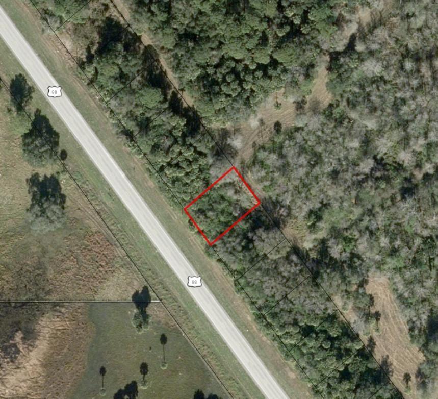 An aerial view shows a rectangular parcel of land outlined in red beside a highway — 3752 US Highway 98, Okeechobee FL 34972, OKEECHOBEE, FL