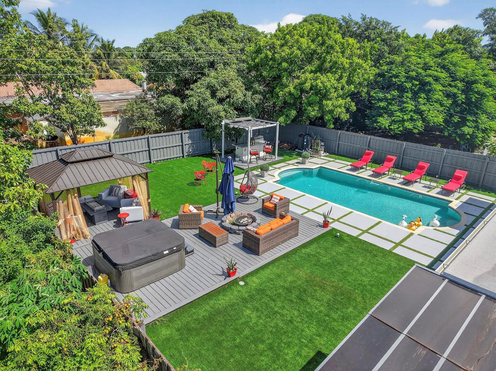 An aerial view of a backyard featuring a swimming pool, hot tub, gazebo, and patio — 449 SW 4th Avenue, Boynton Beach FL 33435, BOYNTON BEACH, FL