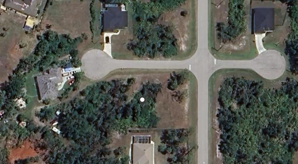 This aerial map shows a vacant residential lot situated at a suburban street intersection — 107 MINNOW WAY, ROTONDA WEST, FL