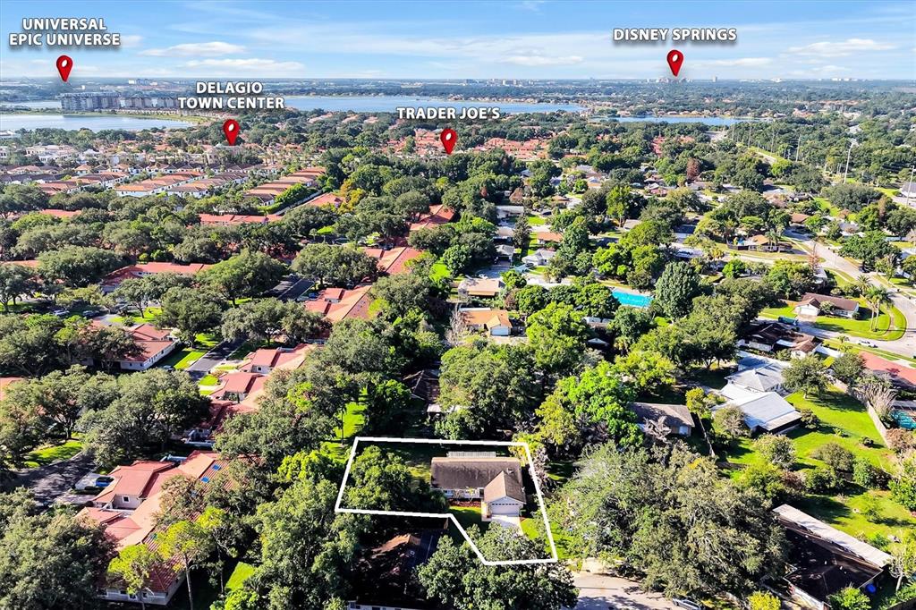 This is an aerial view of a residential property with digital location markers for nearby landmarks — 8405 WAIALAE COURT, ORLANDO, FL