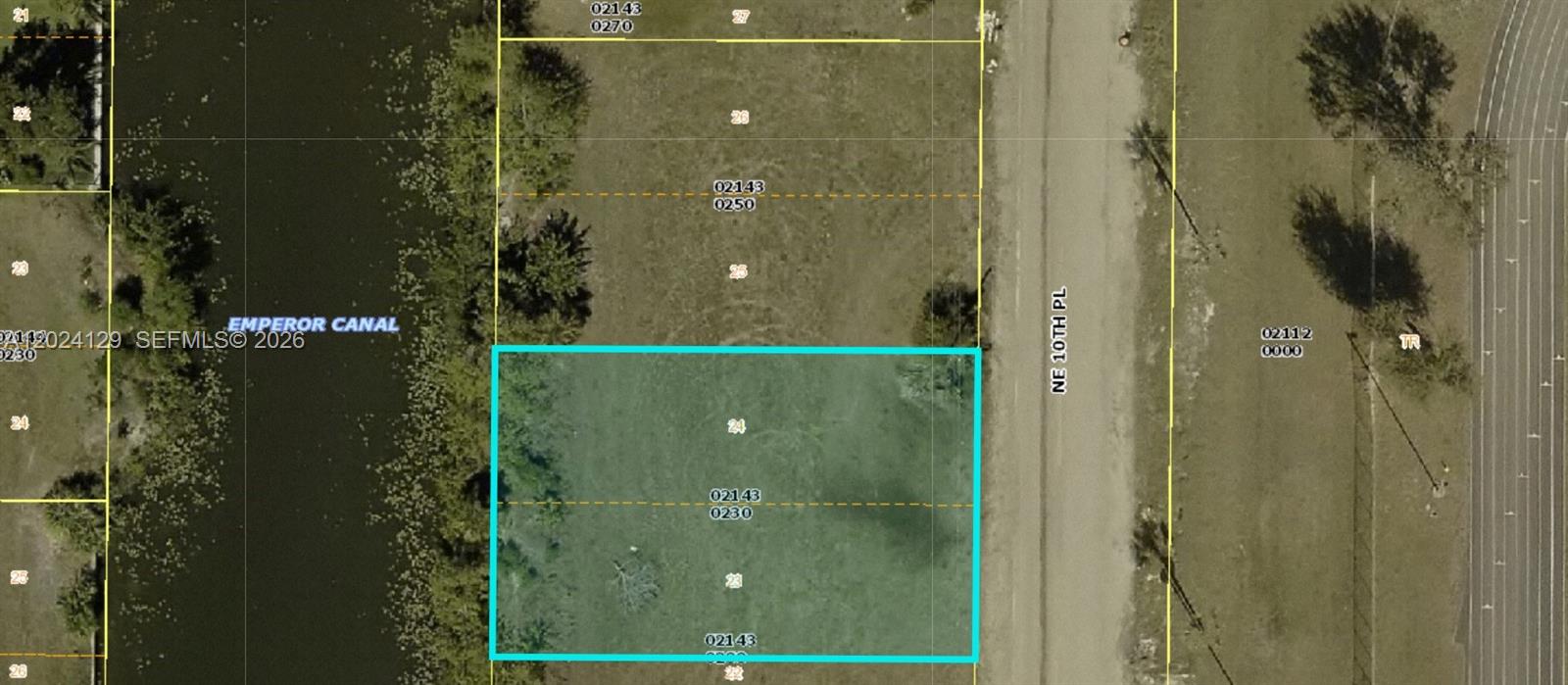 This is a map showing a rectangular plot of land bordered by a canal and road — 1804 NE 10th Pl, Cape Coral FL 33909, CAPE CORAL, FL