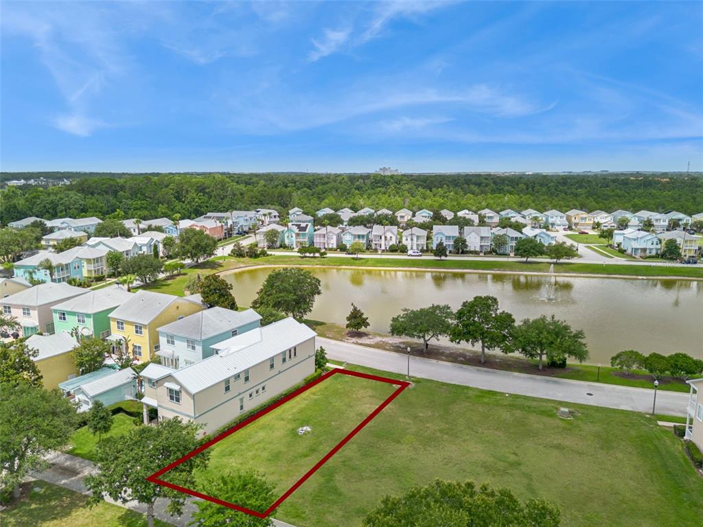 An aerial view shows a vacant rectangular lot outlined in red next to a residential street — 1529 FAIRVIEW CIRCLE, REUNION, FL