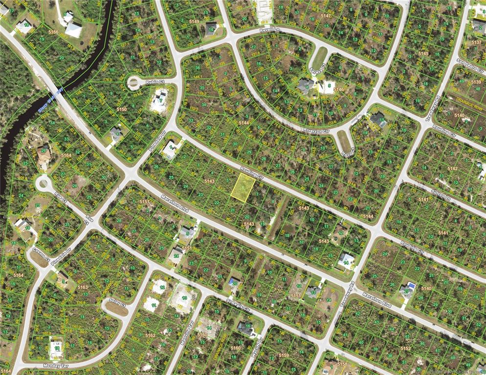 This is an aerial map showing residential lots and streets in a suburban neighborhood — 13153 ROUDING CIRCLE, PORT CHARLOTTE, FL