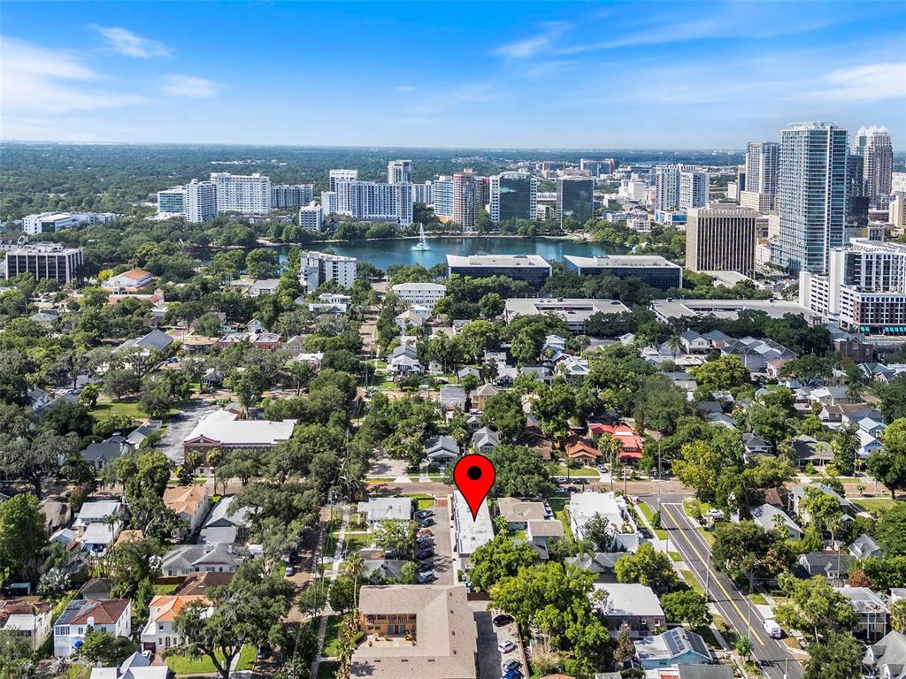 An aerial view shows a red location pin over a residential street in Orlando — 317 E AMELIA STREET UNIT 7, ORLANDO, FL