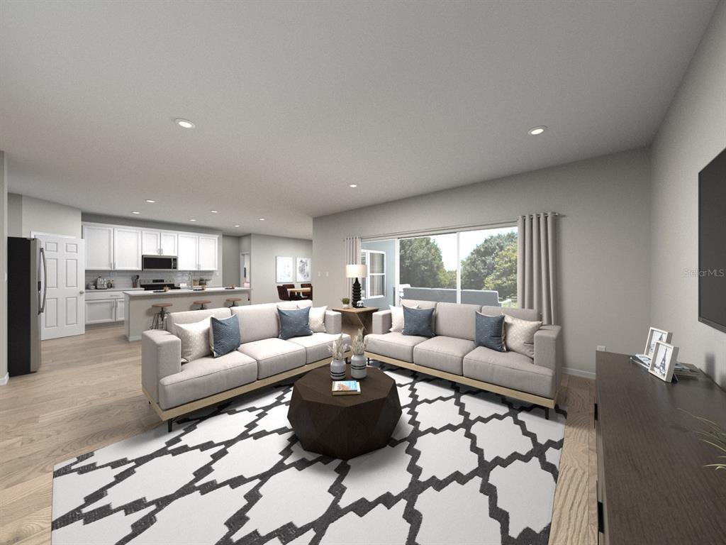 This is a digital rendering of an open-concept living room and kitchen with modern finishes — 44450 FRONTIER DRIVE, PUNTA GORDA, FL