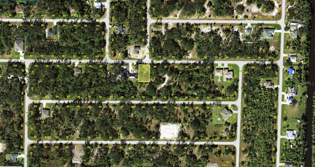 This is an aerial map view of a vacant residential lot highlighted in yellow — 19143 ROOSEVELT AVENUE, PORT CHARLOTTE, FL