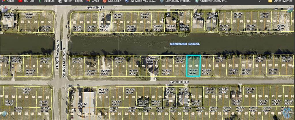 This is a map showing residential lots along the Hermosa Canal in a suburban neighborhood — 1423 NW 8TH TERRACE, CAPE CORAL, FL