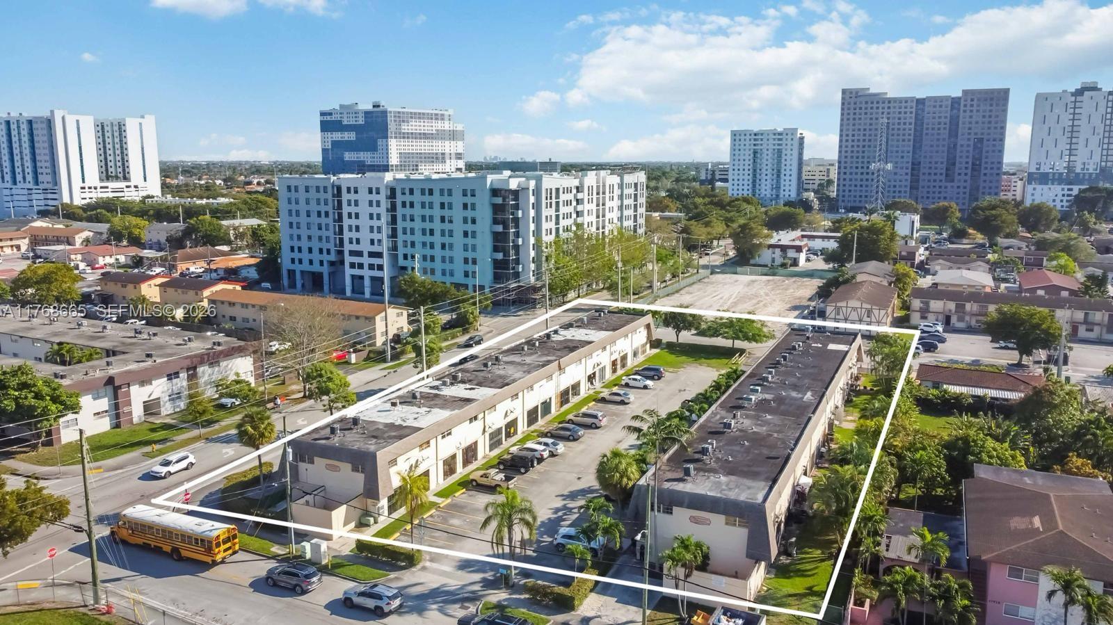 An aerial view shows two adjacent commercial buildings with flat roofs and a central parking lot — 10904 SW 2nd, Sweetwater FL 33174, SWEETWATER, FL