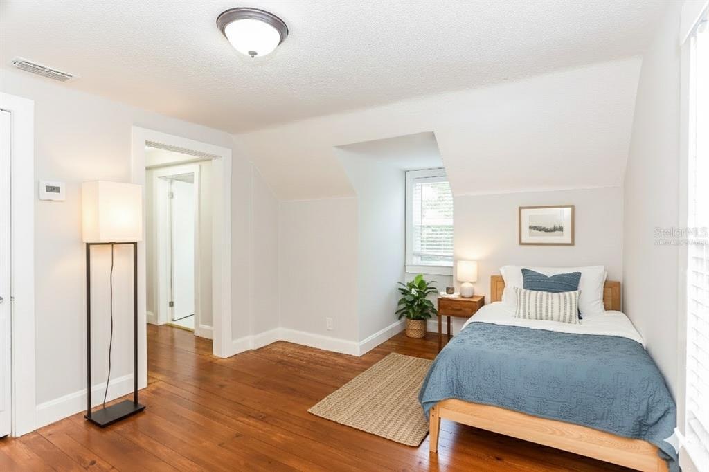 A bedroom with hardwood floors, a single bed, and a dormer window — 4571 PARK STREET, JACKSONVILLE, FL