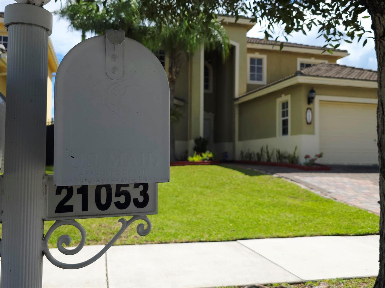 A white mailbox with the number 21053 stands in front of a two-story suburban house — 21053 SW 88th Place, Cutler Bay FL 33189, CUTLER BAY, FL