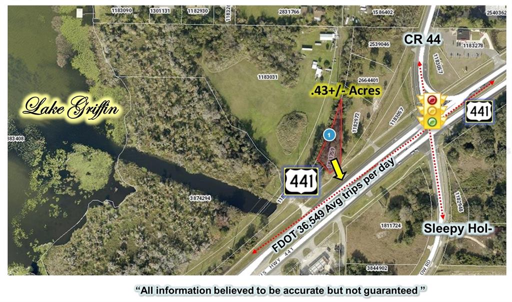 An aerial map shows a triangular parcel of land located near a highway intersection and lake — 7503 US HIGHWAY 441, LEESBURG, FL