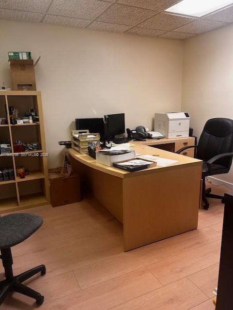 A home office features a light wood desk, a black office chair, and a shelving unit — 13318 SW 128th St, Miami FL 33186, MIAMI, FL