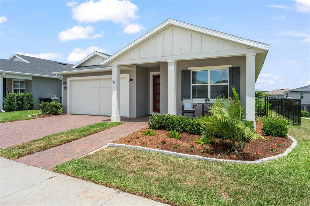 A single-story house with a brick driveway, gray exterior, and a covered front porch — 2790 PARK RIDGE STREET, APOPKA, FL