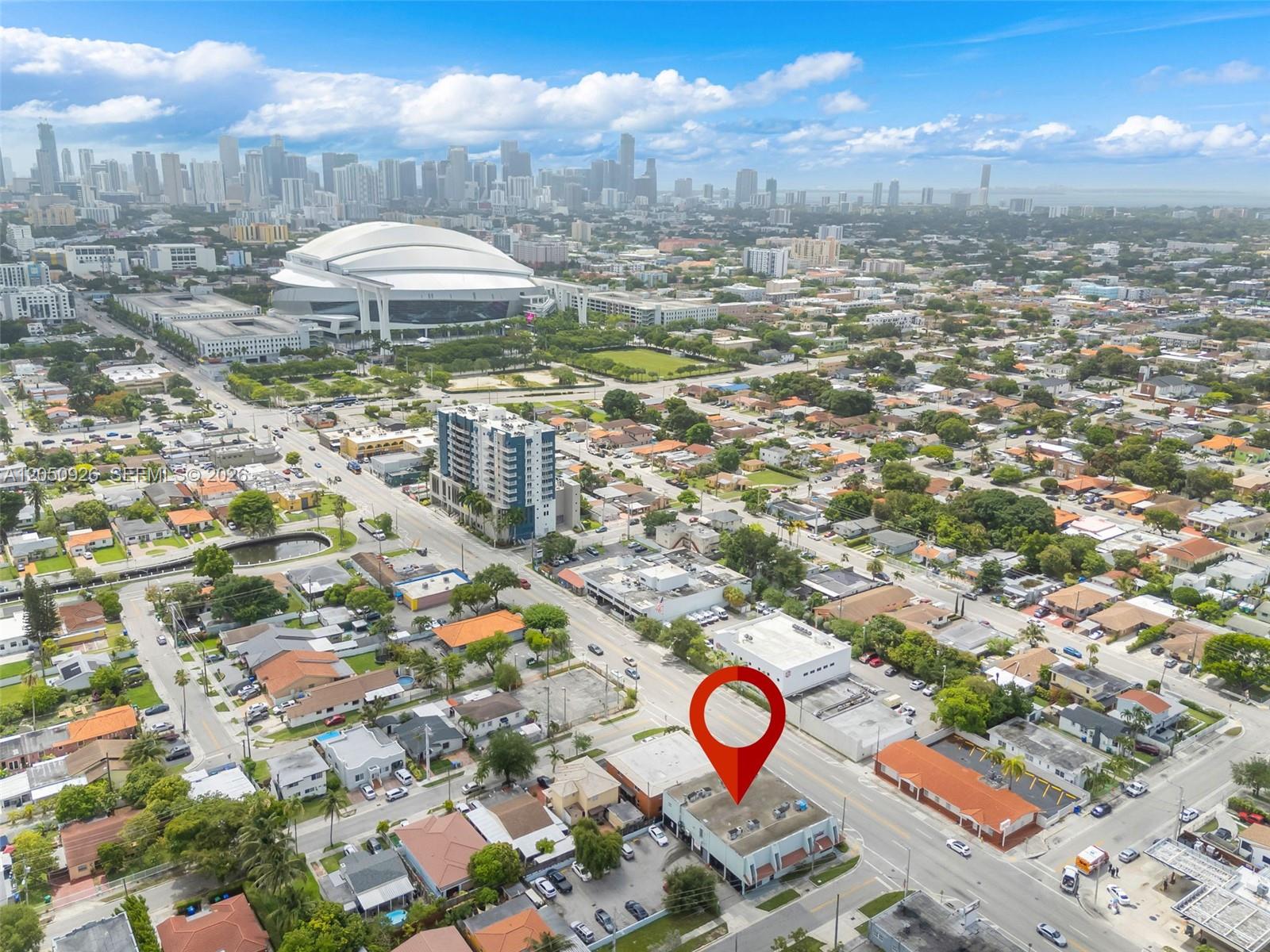 An aerial view shows a commercial building marked with a red pin in a city — 1879 NW 7th St # 2, Miami FL 33125, MIAMI, FL