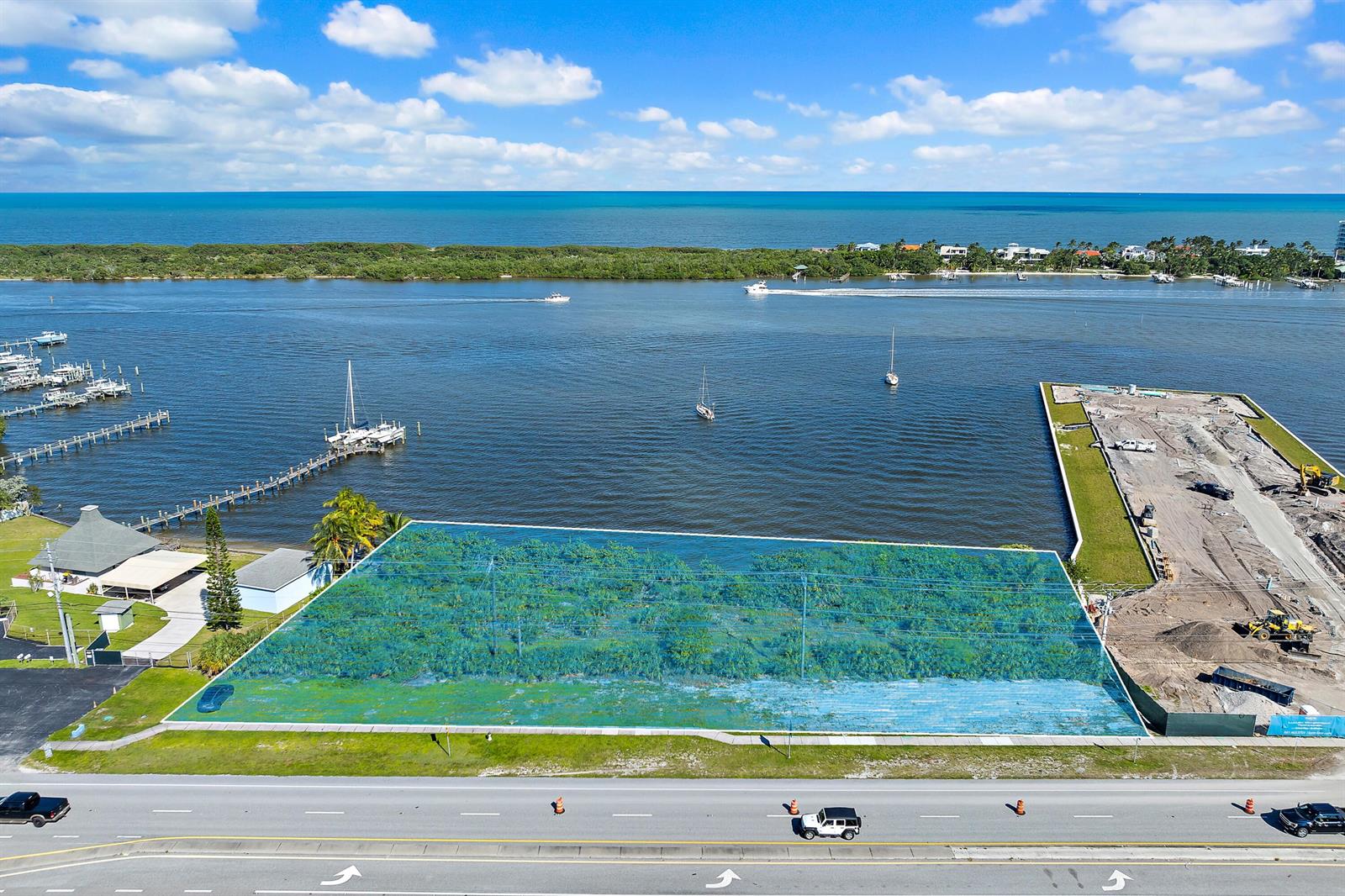 An aerial view shows a rectangular vacant lot highlighted in blue next to a waterfront — 0000 SE Federal Highway, Jupiter FL 33469, JUPITER, FL