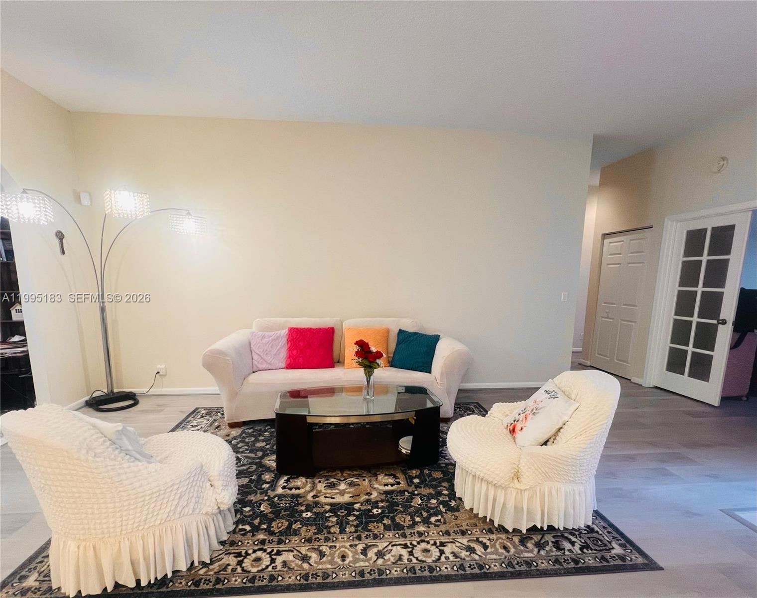 A living room features a sofa, two armchairs, a glass coffee table, and an area rug — 3746 Spring Crest Ct, Lake Worth FL 33467, LAKE WORTH, FL