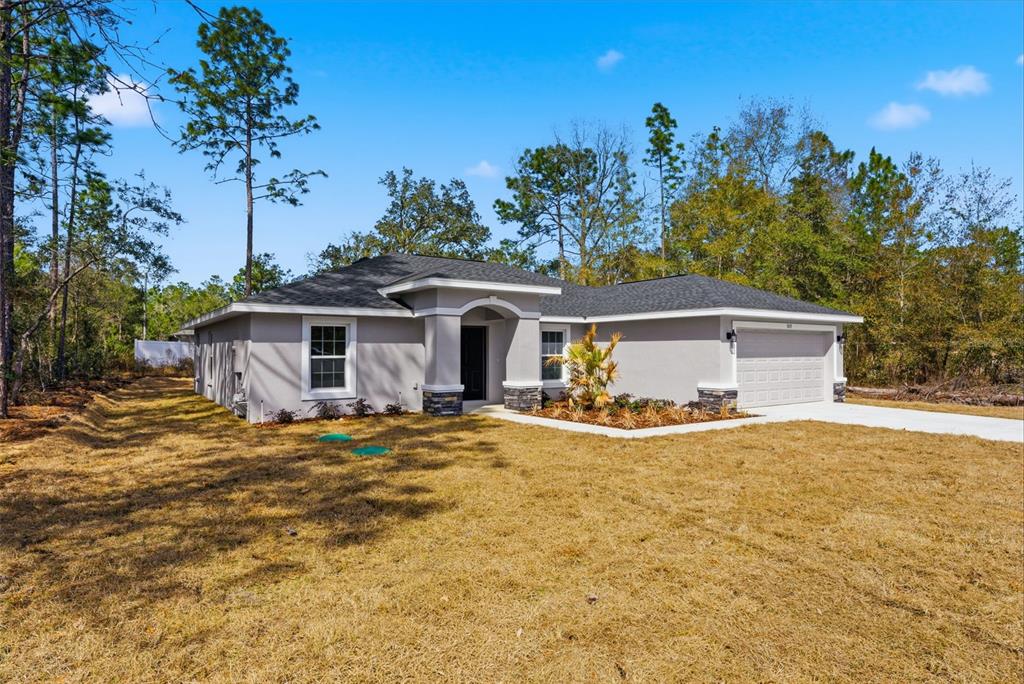 This is a floor plan for a single-story house with three bedrooms and a garage — 3115 W FAIRBANK DRIVE, CITRUS SPRINGS, FL