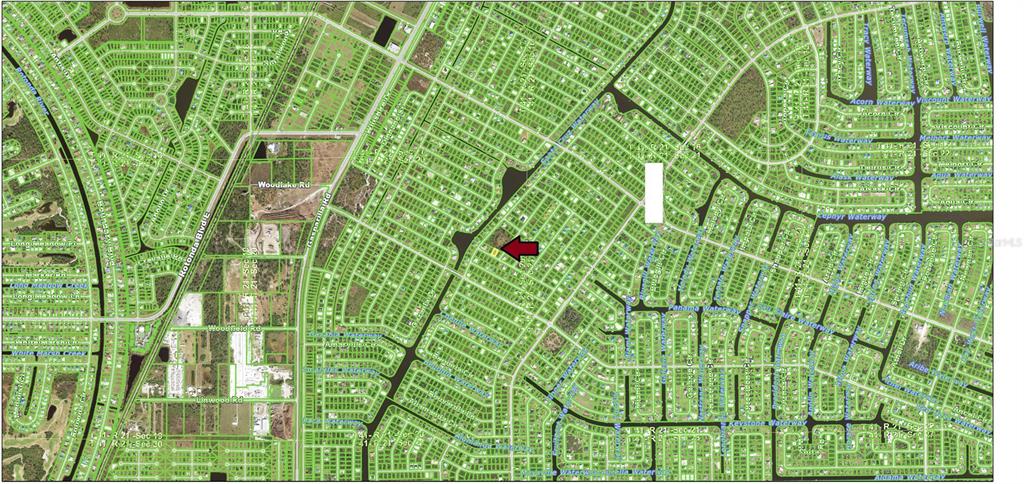 This is a map showing a highlighted residential lot within a large suburban neighborhood — 13488 FROST LANE, PORT CHARLOTTE, FL