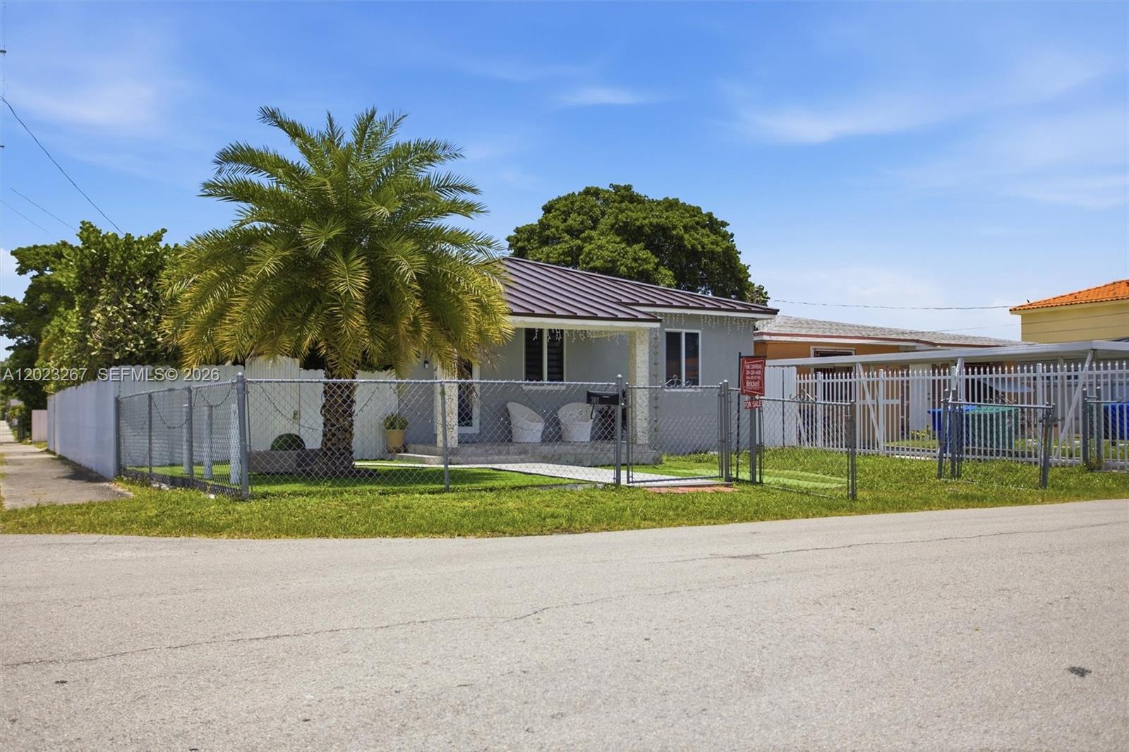 A single-story house with a metal roof, a front porch, and a chain-link fence — 301 SW 36th Ave, Miami FL 33135, MIAMI, FL